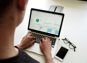 A person is using a laptop on the table